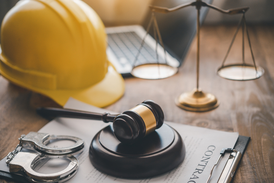 Judge's hammer and helmet Law and Justice about labor law co