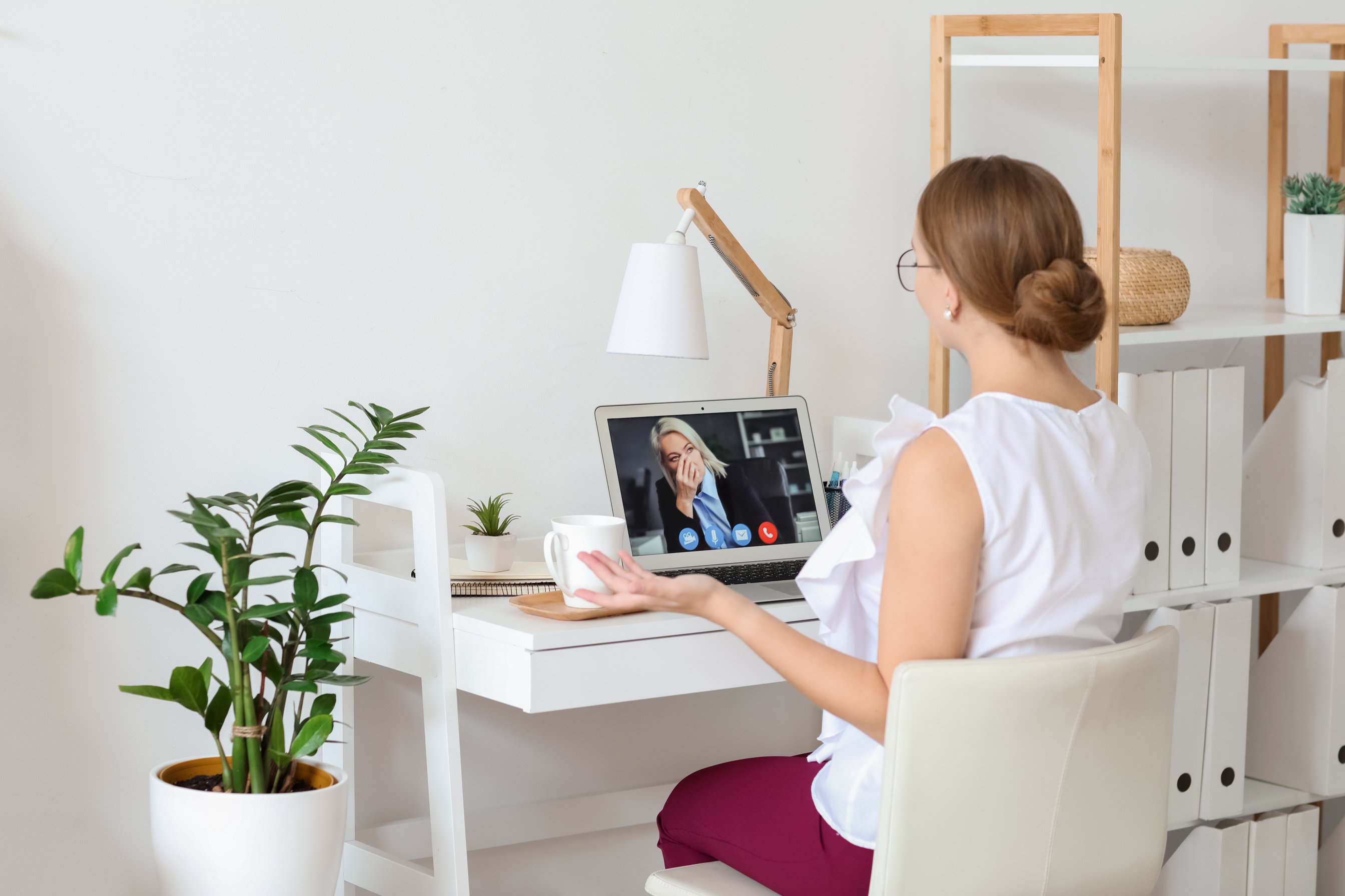 Psychologist Working with Patient Online While Sitting in Office